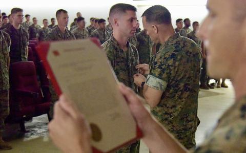 Marine earns lifesaving medal for rescuing overturned sailors