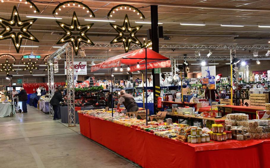 Christmas decorations and goods line a table at a Holiday Bazaar.