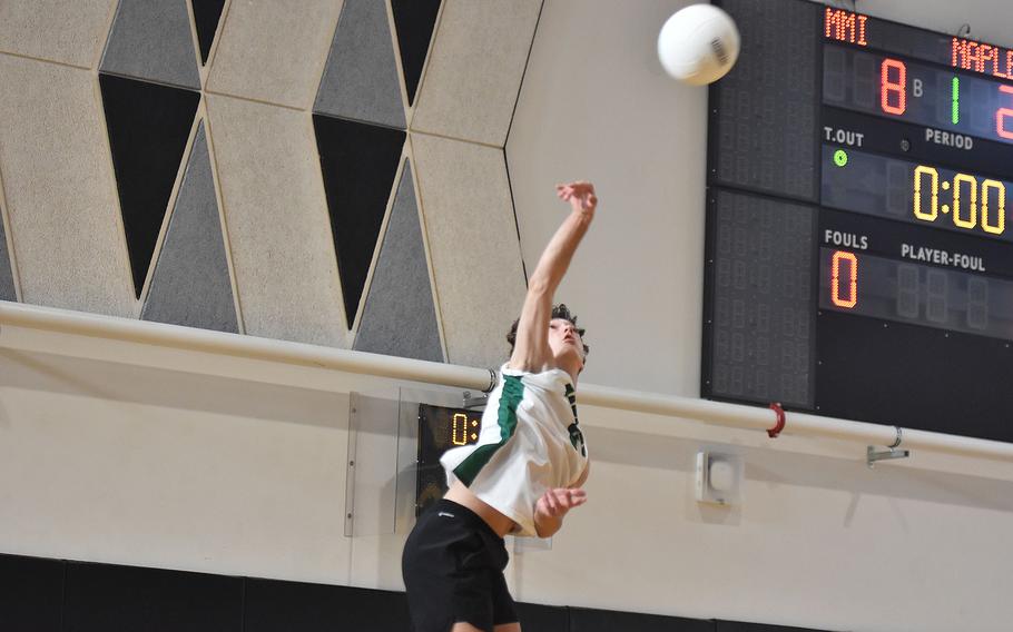 Teyfen Jones hits a jump serve.