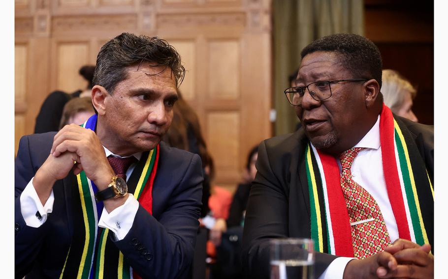 Director-General of the Department of International Relations and Cooperation of South Africa Zane Dangor and South African Ambassador to the Netherlands Vusimuzi Madonsela talk at the International Court of Justice in The Hague Netherlands on May 16, 2024. 