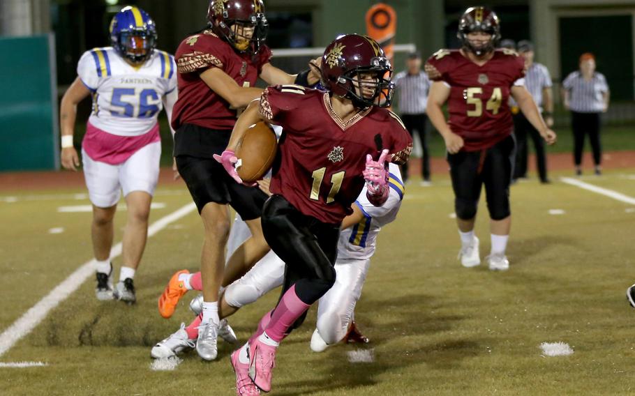 Kameron Ramos runs with the football.