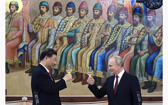 FILE - Russian President Vladimir Putin, right, and Chinese President Xi Jinping toast during their dinner at The Palace of the Facets, a building in the Moscow Kremlin, Russia, on March 21, 2023. The EU is particularly disturbed by President Vladimir Putin’s plans to deploy tactical nuclear weapons to Belarus. That announcement was made just days after Xi and Putin met to cement their “no-limits friendship.” (Pavel Byrkin, Sputnik, Kremlin Pool Photo via AP, File)