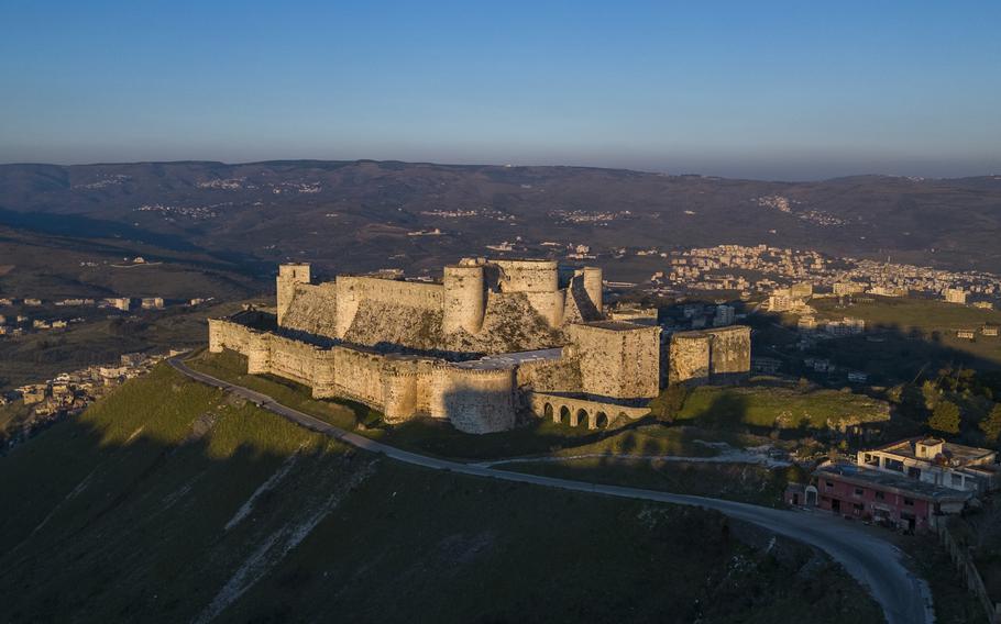 An aerial view shows the sun sets over Krak des Chevaliers.