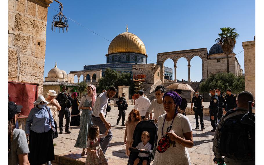 A group of Jewish visitors, accompanied by Israeli police, leave after touring the Temple Mount in August 2021. 