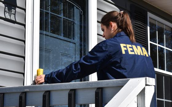 Smyth County, Va. (Oct. 10, 2024) - A FEMA Disaster Survivor Assistance Specialist leaves a flyer with information on applying for disaster assistance after Hurricane Helene at a home in Smyth County, Va., on Oct. 10. (FEMA Photo by Philip Maramba)