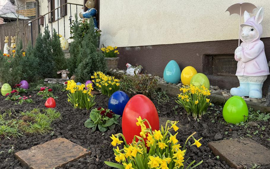 A German yard is decorated for Easter with eggs and bunnies.