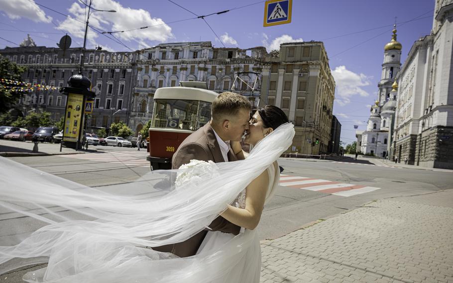 Karima and Serhiy Kovalenko embrace along Heroes of Ukraine Avenue in Kharkiv on June 21. 