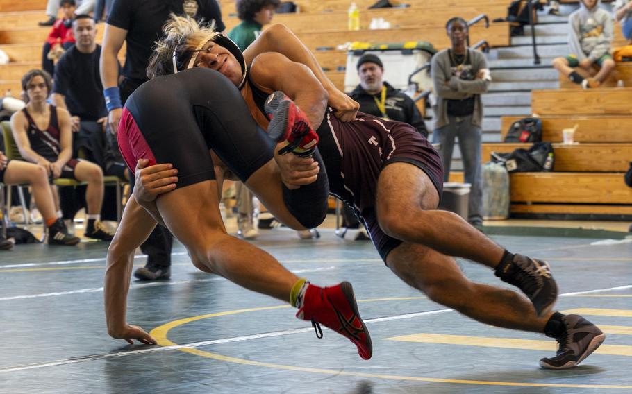 Isaiah Segarra wrestles on the mat.