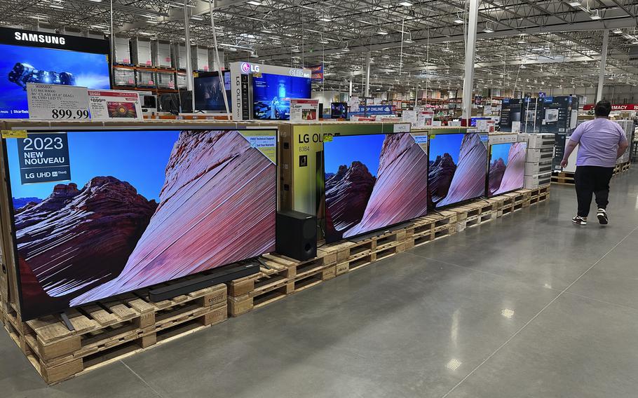 A display of big-screen TVs.