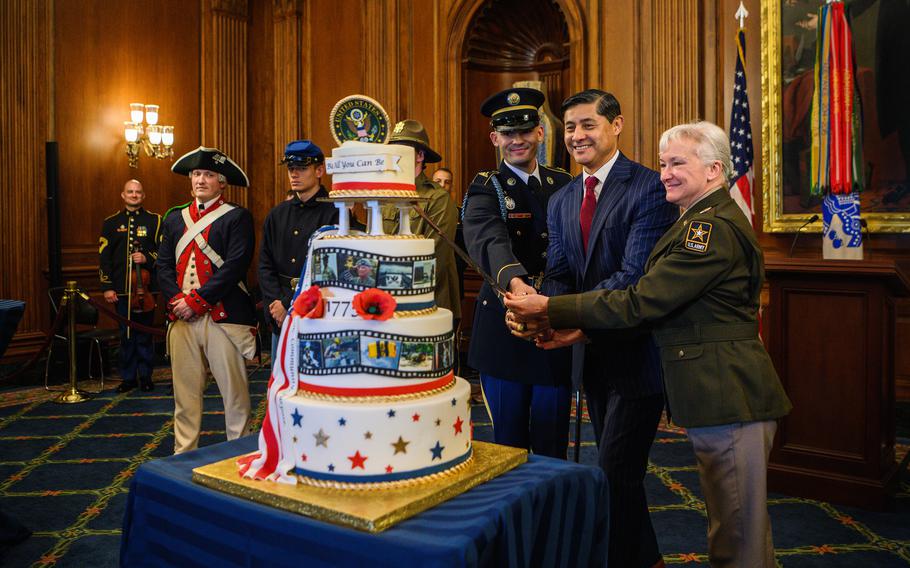 Army Pfc. Daniel Adams, assigned to the 3rd Infantry Regiment (The Old Guard), Deputy Under Secretary of the Army Mario Diaz, and Director of the Army Staff Lt. Gen. Laura Potter participate in the Army 249th Birthday cake-cutting ceremony at the U.S. Capitol in Washington, D.C., June 13, 2024. 