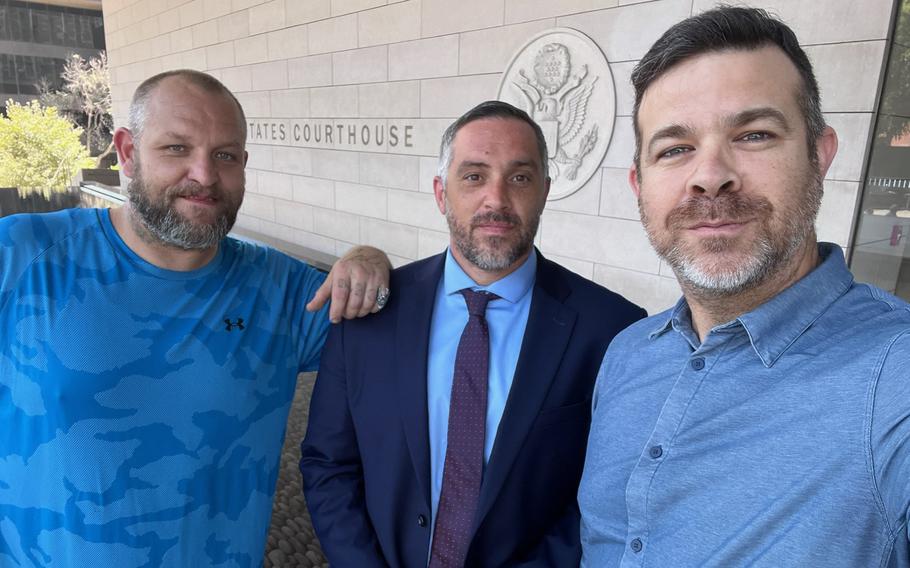 Rob Reynolds, center, who advocates for homeless veterans, stands outside the federal courthouse in Los Angeles with Iraq war veteran Joshua Petitt, left, and Marine veteran Mike Dowling.