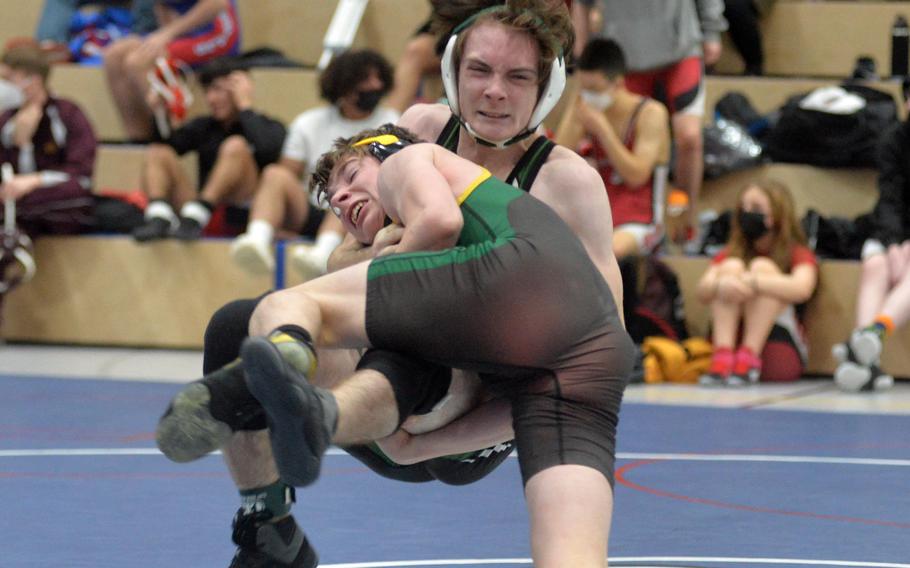 SHAPE’s Jacob Huff , foreground and AFNORTH’s Colin Scharfenstine grapple in a 120-pound match at the high school 2022 Wrestling Tournament in Ramstein. Scharfenstine won the match.