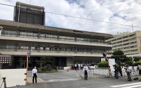 Reporters covering a U.S. airman’s trial on sexual assault and kidnapping charges wait outside Naha District Court on Okinawa, Dec. 13, 2024. 