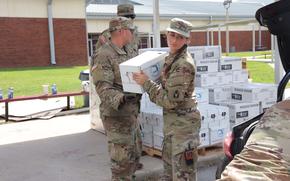 Soldiers from the 2-116th Field Artillery pass out food and water to civilians in Perry, Fla., on September 29, 2024. FLARNG has established PODs throughout the area to assist those affected by Hurricane Helene. (U.S. Army photo by Sgt. Jalen Thomas, 107th MPAD, FLARNG)