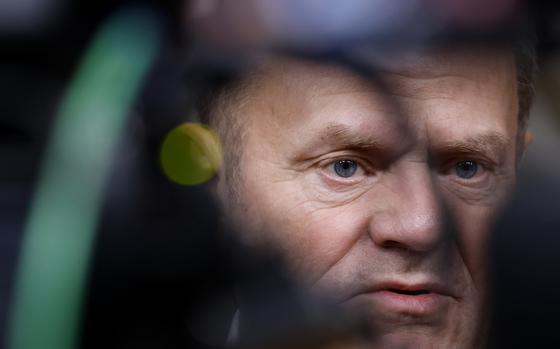 Poland's Prime Minister Donald Tusk speaks with the media prior to a group photo at an EU summit in Brussels, Thursday, Dec. 19, 2024. (AP Photo/Omar Havana)