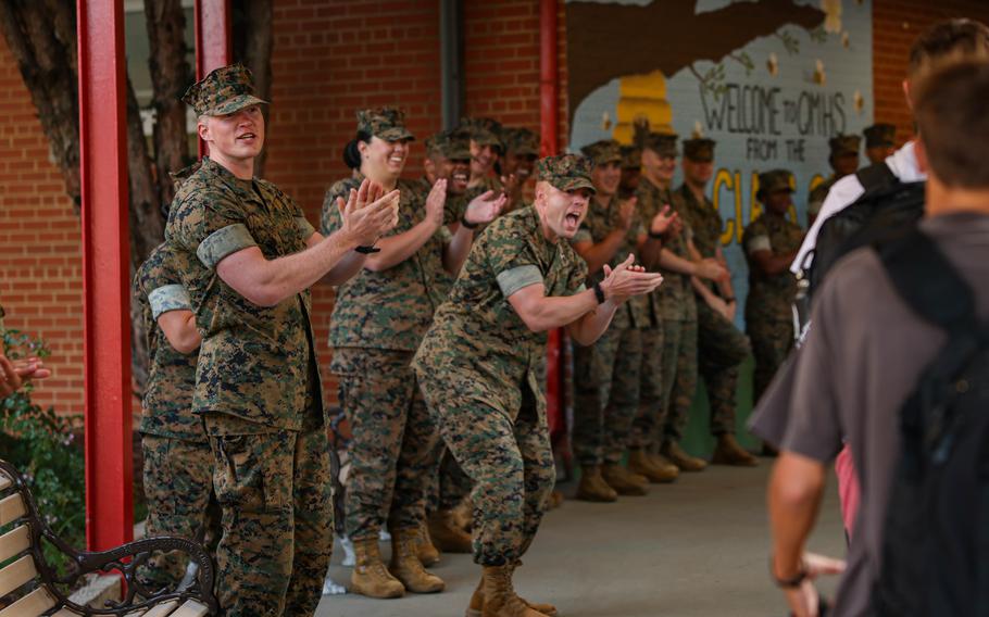 U.S. Marines cheer on students during a back-to-school celebration at the Quantico Middle/High School on Marine Corps Base Quantico, Va., Aug. 21, 2024.  