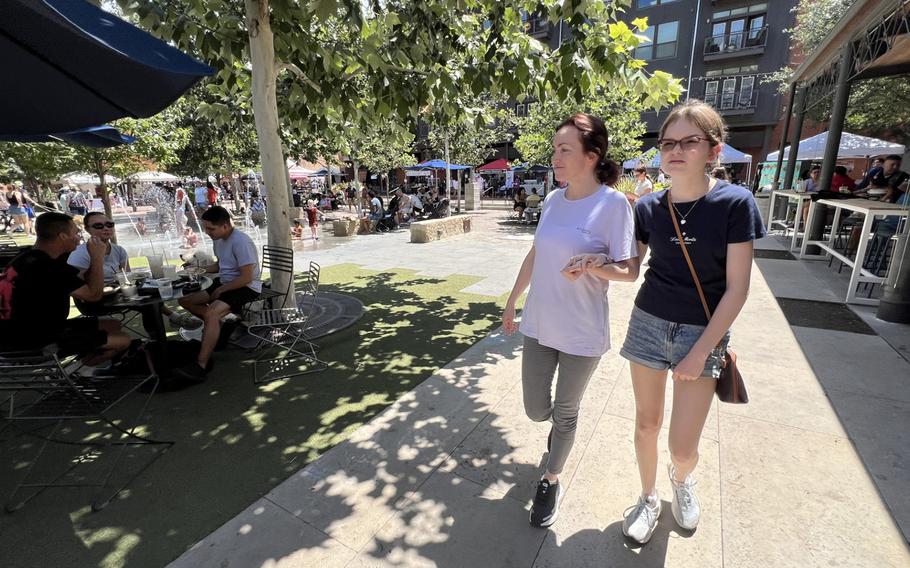 Alsu Kurmasheva, left, walks with her daughter Miriam Butorin in the Pearl District in San Antonio. 