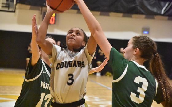 Jenina Smith was one of the smallest players on the court Friday, Jan. 31, 2025, but that didn't stop her from venturing into the paint for a contested shot against Naples.

Kent Harris/Stars and Stripes