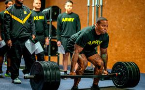 Soldiers do deadlifts during an Army Combat Fitness Test on Dec. 12, 2024, in Sembach, Germany. The Army can safely raise minimum fitness standards for close combat jobs, but setting the bar too high would test the service's acceptance of lower pass rates, according to a new study.