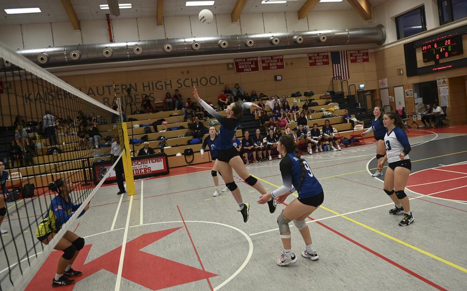 Brussels Brigand Lucia Martinez elevates for a spike over the net, while Sigonella Jaguar Nyeema Fernandez prepares to defend during the DODEA Division III European volleyball semifinals on Oct. 27, 2023, in Kaiserslautern, Germany.