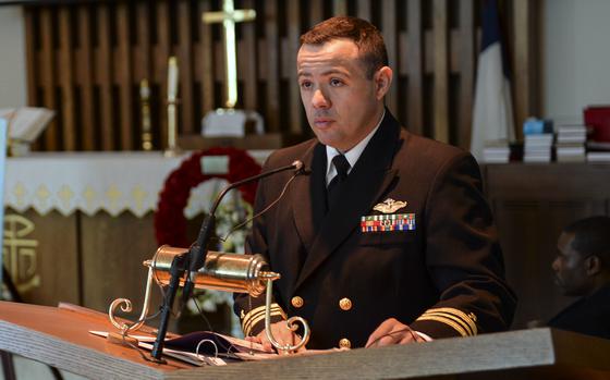 Chaplain Cristiano DeSousa, then a lieutenant commander, delivers the invocation at a memorial service at Naval Station Mayport, Fla., in October 2015.