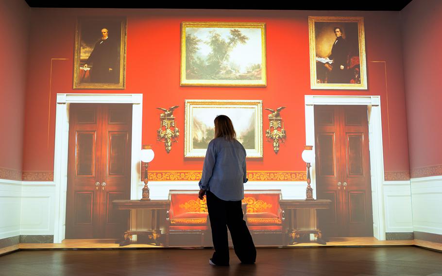 A digital projection of the Red Room, where visitors can touch objects on the walls to learn more about them.