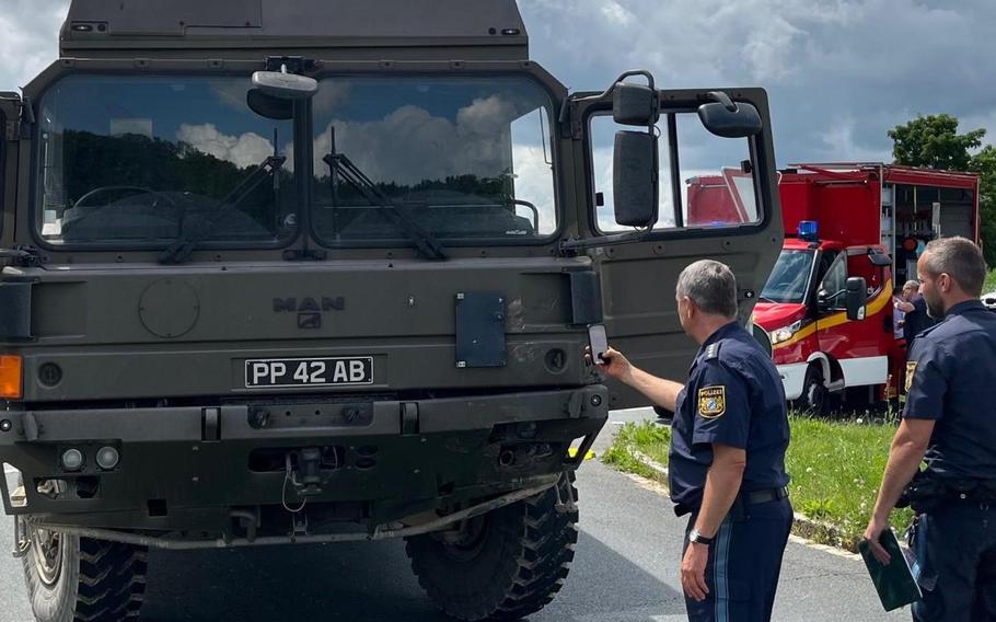 German police photograph a British army truck involved in a fatal accident near Grafenwoehr, Germany, July 11, 2024. The truck, driven by a British soldier, struck and killed a German teen motorcyclist.