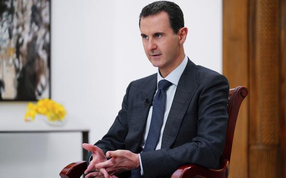 FILE - In this photo released Nov. 9, 2019, by the official news agency SANA, then-President Bashar Assad speaks in Damascus, Syria. (SANA FILE via AP, File)