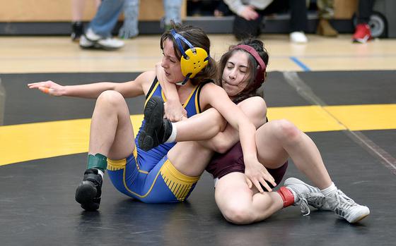 Baumholder's Leilanni Slye pulls Wiesbaden's Carmen Lima onto her back during a 110-pound pool-play match at the 2025 DODEA European wrestling championships on Feb. 6, 2025, at the Wiesbaden Sports and Fitness Center on Clay Kaserne in Wiesbaden, Germany.