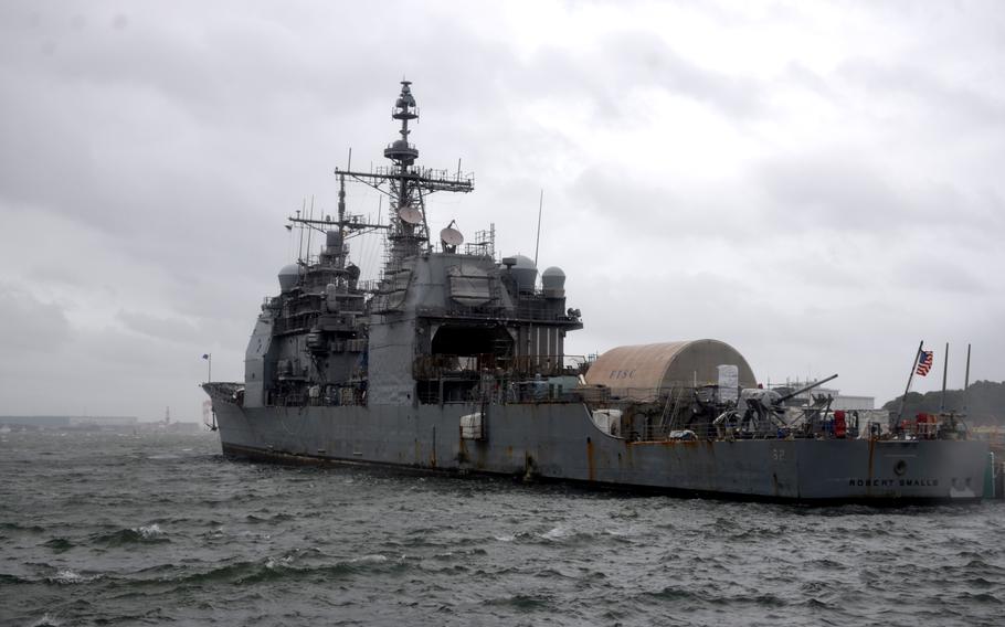 The guided-missile cruiser USS Robert Smalls was one of the few remaining ships in port at Yokosuka Naval Base, Japan, as Typhoon Ampil pass offshore on Aug. 16, 2024.