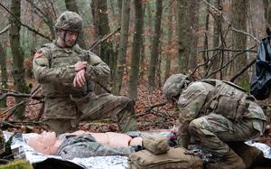 Sgt. Andrew Villegas, left, and Cpl. Billy Wiggins, combat medics assigned to the 52nd Air Defense Artillery Brigade, participate in the Europe Best Medic Competition in Landstuhl, Germany, Dec. 11, 2024.