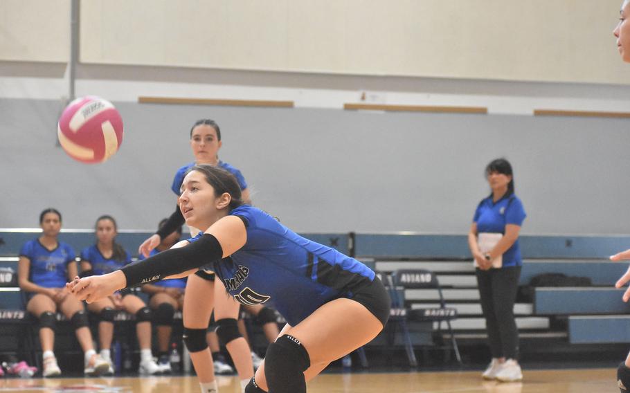 Rota’s Madison Lewis stretches forward to dig the ball up and send it towards a teammate in the front row in the Admirals’ five-set victory over the Aviano Saints on Saturday, Oct. 14, 2023.