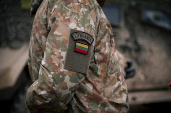 A Lithuanian soldier where a country patch on his uniform sleeve.