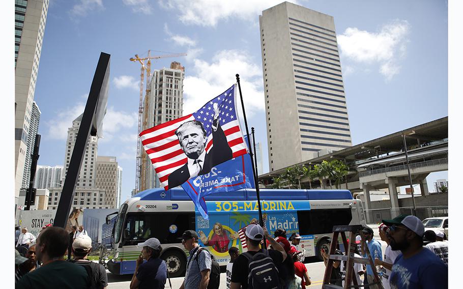 Supporters of former President Donald Trump look on before his motorcade departs the Wilkie D. Ferguson Jr. United States Federal Courthouse where he was arraigned on charges of mishandling classified documents on June 13, 2023, in Miami. 