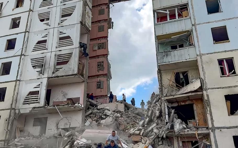 In this photo taken from video released by Belgorod regional governor Vyacheslav Gladkov’s Telegram channel on Sunday, May 12, 2024, Russian emergency services work at the scene of a partially collapsed block of flats authorities said was hit during an attack by Ukrainian shelling, in Belgorod, Russia. 