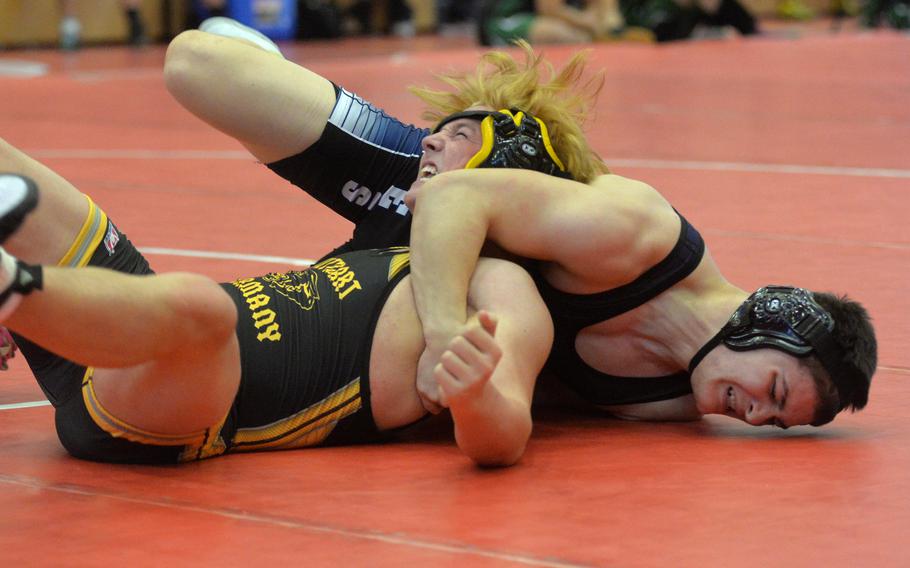 Vilseck’s Jaiden Workman pressures Stuttgart’s Jack Gruver in a 190-pound match on opening day of the high school 2022 Wrestling Tournament in Kaiserslautern. Workman won the match.