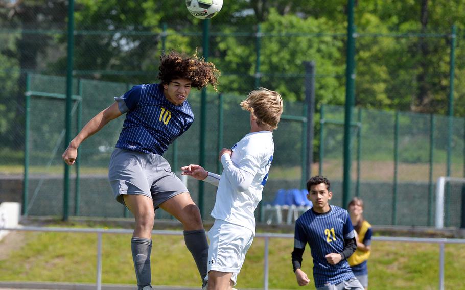 Ansbach’s Daeveon Browne takes a header against Sigonella’s Sebastain Hedemand in the Division III boys final at the DODEA-Europe soccer championships in Ramstein, Germany, May 18, 2023.Browne scored the Cougars lone goal in their 4-1 loss to the Jaguars.