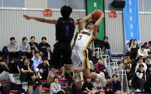 Humphreys' Brandon Howell shoots against Osan's Jayden Hightower.