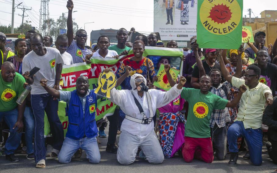 Demonstrators hold banners reading in Swahili  “Sitaki nuclear”