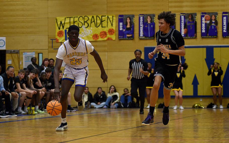 Joel Idowu dribbles up the court.