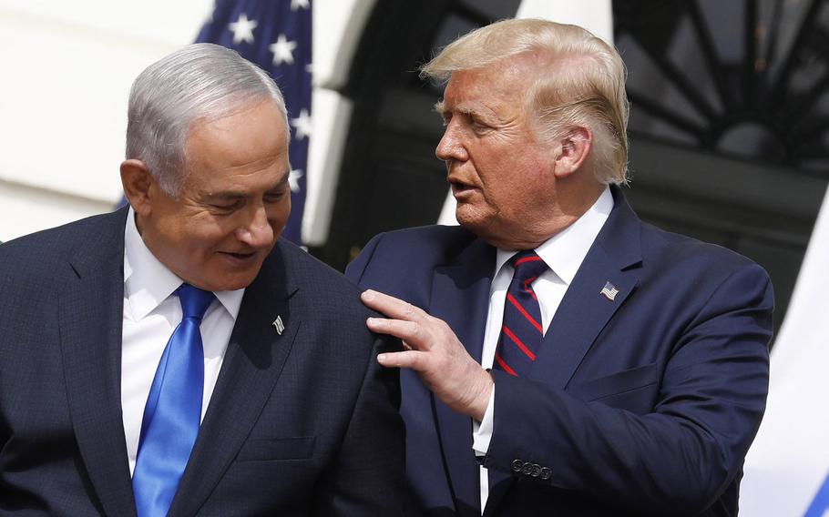 President Donald Trump places a hand on the shoulder of Israeli Prime Minister Benjamin Netanyahu, Sept. 15, 2020.