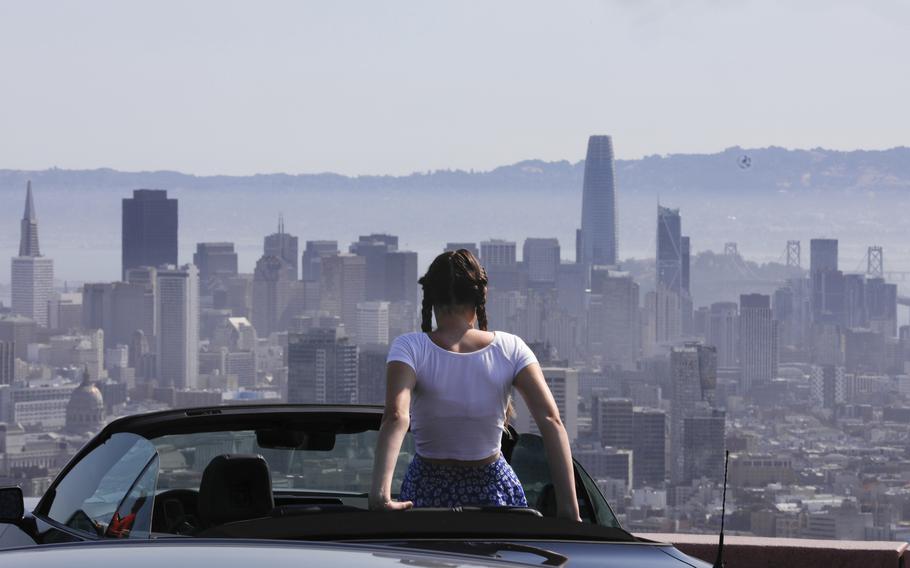 Lilou Guerra, 16, of France is dressed for sunny weather during a heat wave while she takes in the view of San Francisco on Wednesday, July 3, 2024. 