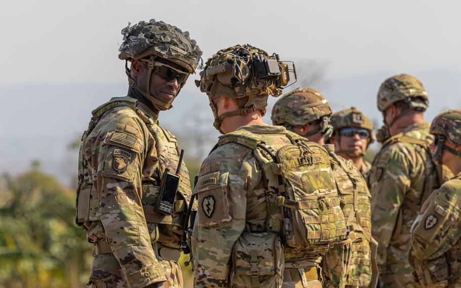 Col. Adisa King listens to soldier