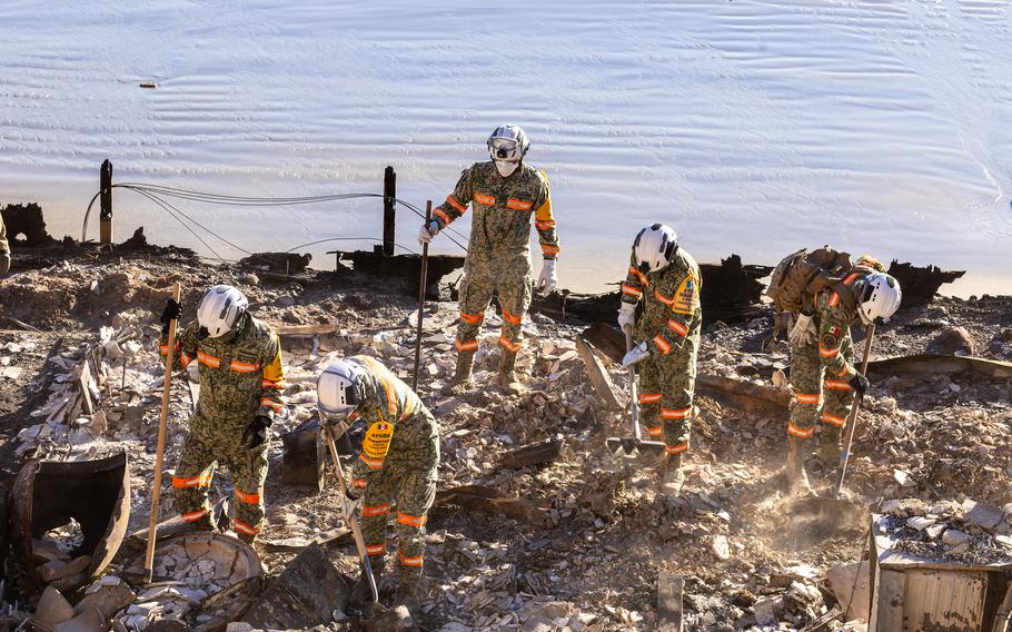 Mexican National Guardsmen help with the grim task of searching for remains in the rubble of a beachfront home on Pacific Coast Highway on Jan. 14, 2025, in Malibu, California. (Brian van der Brug/TNS)