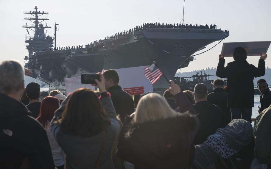The aircraft carrier USS Nimitz pulls into port at Naval Base Kitsap, Wash., in December 2017.