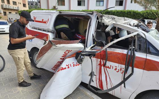 FILE - Palestinian medics inspect a damaged Ambulance hit by an Israeli air strike inside Nasser Hospital in Khan Younis, southern Gaza Strip, Saturday, Oct. 7, 2023. (AP Photo, File)