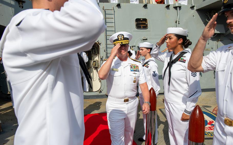 Adm. Daryl Caudle, commander salutes the crew