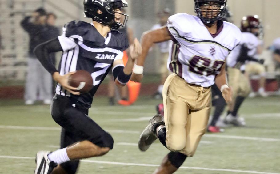 Zama’s Adrian Santiago Cruz runs with the football.