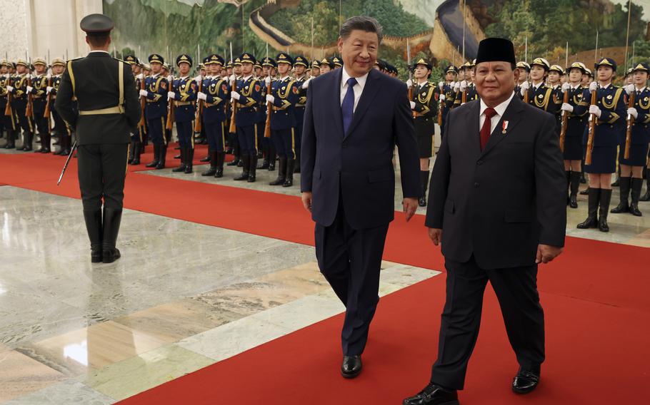 Chinese President Xi Jinping and Indonesian President Prabowo Subianto walk together during a welcome ceremony in Beijing, China, Nov. 9, 2024. 