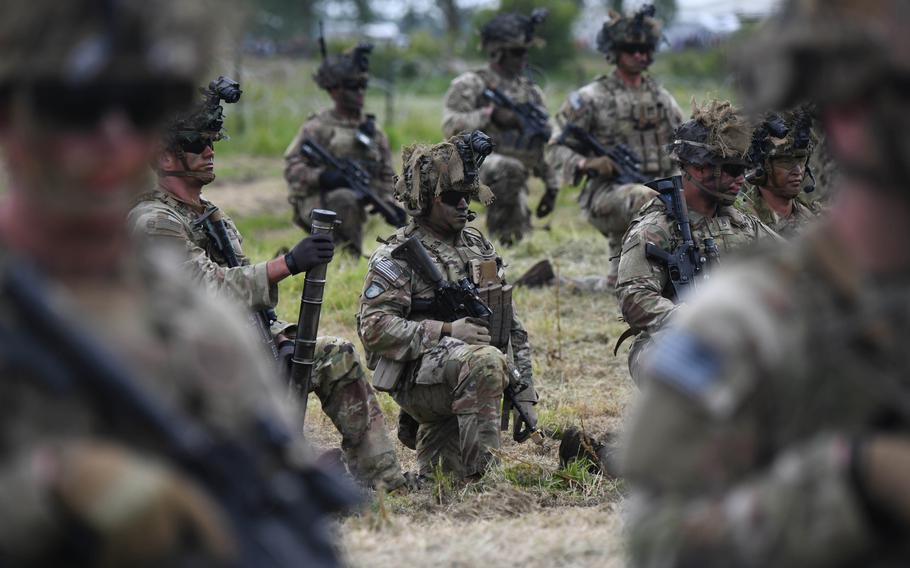 Soldiers assigned to the 101st Airborne Division participate in an air assault demonstration in Carentan, France, on June 2, 2024. During World War II, the unit liberated the town after landing by parachute on D-Day. 